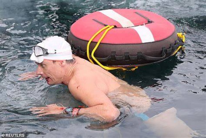 Vencl&nbsp; is pictured emerging from the icy water after his successful attempt